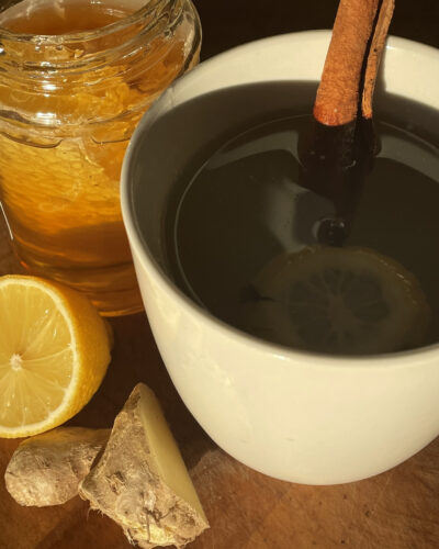 Mug of Hot toddy with lemon, honey and ginger